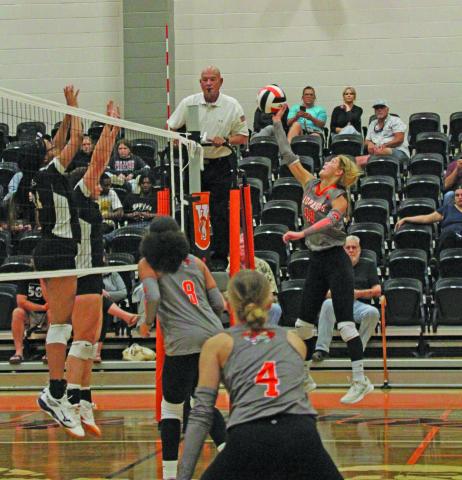 Photo by Anna Hernandez Van Vleck’s Isabella van Drutten (10) hits the ball over the net during Friday night's volleyball game against Malakoff.