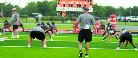 Photo by Anna Hernandez Van Vleck Coaches oversee Leopard drills during first week of workouts. Leps will scrimmage Weimar at home Friday.