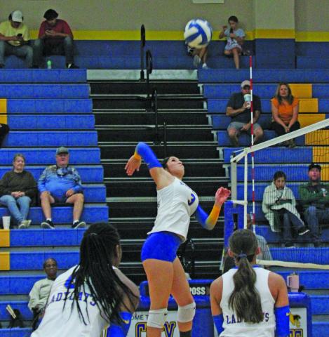 Photo by Anna Hernandez Bay City Ladycat Ameryce Jacques (3) goes up for a solid hit at the net in last week’s game against Boling.	 