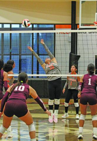 Photo by Anna Hernandez Van Vleck’s Angela Monroy (13) tips the ball in the direction for a teammate to spike the ball, in a recent game with Columbia.