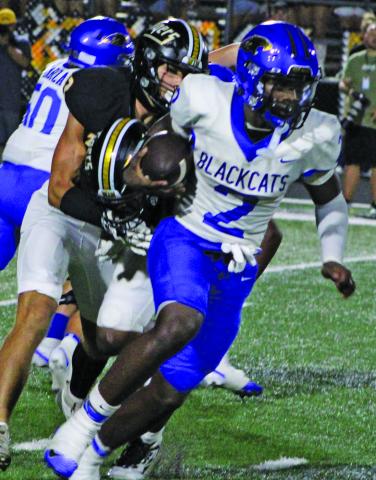Sentinel Photo/Mike Reddell Blackcat junior Kemarion Wiggins (2) picks up yardage against Sealy. Wiggins led all Bay City rushers with 106 yards.