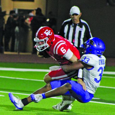 Sentinel Photo/Mike Reddell Senior defensive end Jordan Oneal (33) has a firm grasp of El Campo quarterback Colt Reeve (6) Friday night.