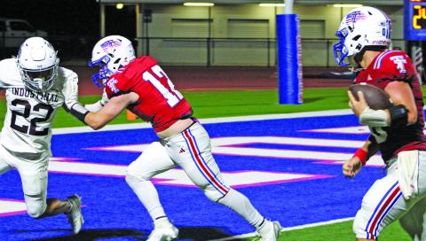 Sentinel Photo/Mike Reddell Tidehaven’s Kale Russell picks up a block before scoring.