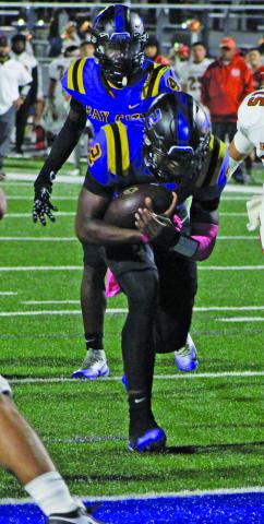 Sentinel Photo/Mike Reddell Bay City quarterback Keimarion Wiggins (2) barrels ahead for a Blackcat touchdown. 