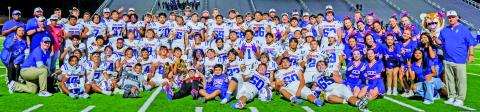 Courtesy of Migas Productions The Tidehaven Tigers show off their bi-district trophy (center) after defeating Comfort Thursday, Nov. 13, in Seguin.