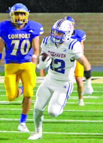 Sentinel Photo/MaLinda Reddell Junior wide receiver Ashton Klaiber (12) breaks away from Comfort defenders for a significant Tiger gain.