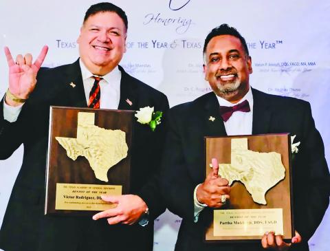 Texas A&M photo Dr. Victor Rodriguez of Houston, left, and Dr. Partha Mukherji, a former Bay City resident, shared Texas Dentist of the Year honor. Both flash the well-known signs of their respective schools.
