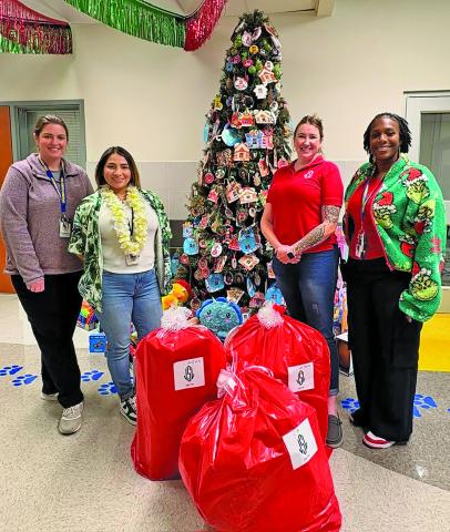 JSL photo Junior Service League’s annual JSL Angel Tree project was completed, with volunteers wrapping hundreds of gifts and delivering Christmas cheer to 64 students across 13 local schools.