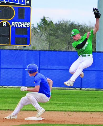 Sentinel Photo/Mike Reddell Blackcat Wade Frasier ducks under a Boling throw to arrive safely at second.