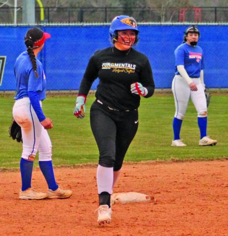 Lady Cat has a smile rounding second as she belted a homer over the fence