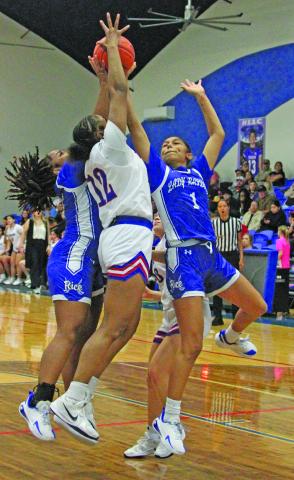 Photo by Anna Hernandez Tidehaven sophomore Nevaeh Dove goes up to reach the ball during a Feb. 10 game against Rice that Tidehaven won 45-20. The Tigerettes stand 28-6 on the season and 12-2 in district (second). Tidehaven started UIL championship playoff action Monday, Feb. 16, in first-round action against Stockdale.