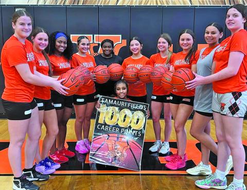 Van Vleck photo Last week, junior Tamauri Fields reached an incredible milestone - 1,000 career points as a Lady Lep varsity basketball player. Above, Fields’ teammates help her celebrate.