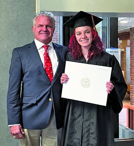 Courtesy photo Amber Michelle Simons and her father, Dr. Dane Simons, show off her recently awarded bachelor’s degree from Harvard University.