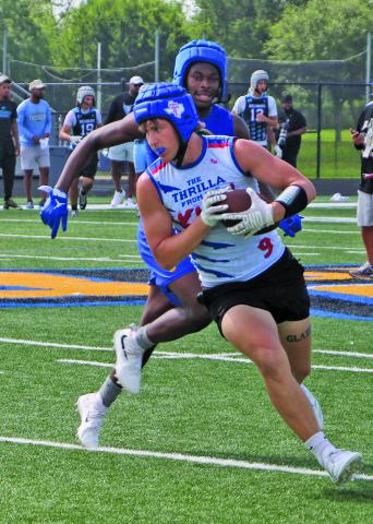 A Tidehaven runner tries to outdistance his Bay City defender in a 7on7 matchup last week during BCISD’s Kings of the South 7on7, Linemen Challenge last week at Memorial Stadium.  Sentinel Photo/Mike Reddell