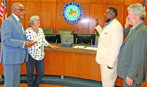 Sentinel Photo/Mike Reddell Shown from left, Bay City Mayor Robert Nelson, City Secretary Jeanna Thompson, and councilmen Corey McCray, and Jim Folse take part in swearing in ceremony last week.
