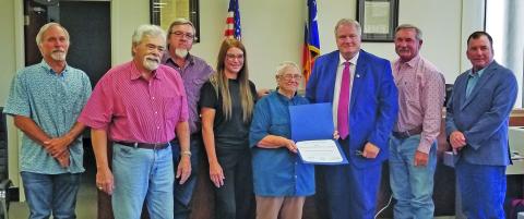Sentinel Photo Commissioners Court accepted Texas Historical Commission’s Distinguished Service Award for Matagorda County Historical Commission at the court’s meeting Monday. MCHC member Edith Crower (center) shows off the state’s recognition. MCHC members Mike Reddell, second from left, and Kristi Lee also took part, with court members Commissioner Bubba Cook, Commissioner Bubba Frick, County Judge Bobby Seiferman, Commissioner Troy Shemek, and Commissioner Mike Estlinbaum.