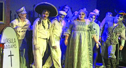 Sentinel Photo/Jessica Shepard Several ghosts of Addams Family members past look on as current members discuss plans for an upcoming dinner event during the production's press night July 29. Over two dozen actors and actresses are part of CAST's "The Addams Family" musical comedy wrapping up this weekend.