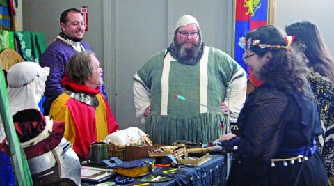 Sentinel Photo/Jessica Shepard Participants in the Art League of Bay City's “Mystic Realms ArtWalk 2026” show off distinctive costumes reflecting a lost world of magic Aug. 15.