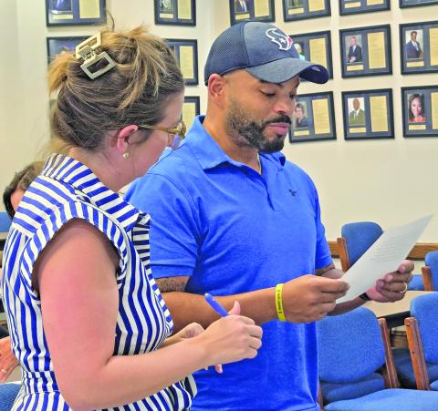 Recently appointed Bay City ISD trustee Justin Matthews, right, was officially installed to the school board Position 4 vacancy on Aug. 12. Position 4 was previously held by the late Priscilla Robinson. Sentinel Photo/ Jessica Shepard