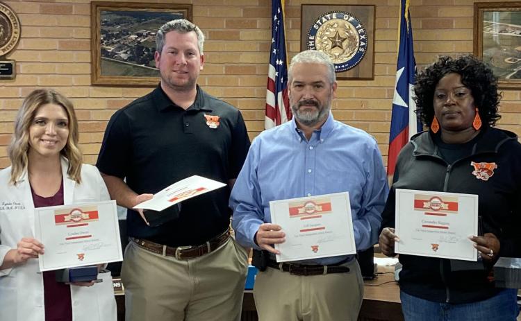 Sentinel photo/Jessica Shepard Van Vleck ISD recognized several staff members for their lifesaving efforts on a junior high student earlier this month. They were awarded the American Heart Association Heartsaver Hero and Top Leopard awards. Those employees are, from left: Gwen Franklin, Lyndee Owen, Michael Polachek, Jeff Jacques, Cassandra Higgins, Will Dowell, and not pictured: Darius Williams.