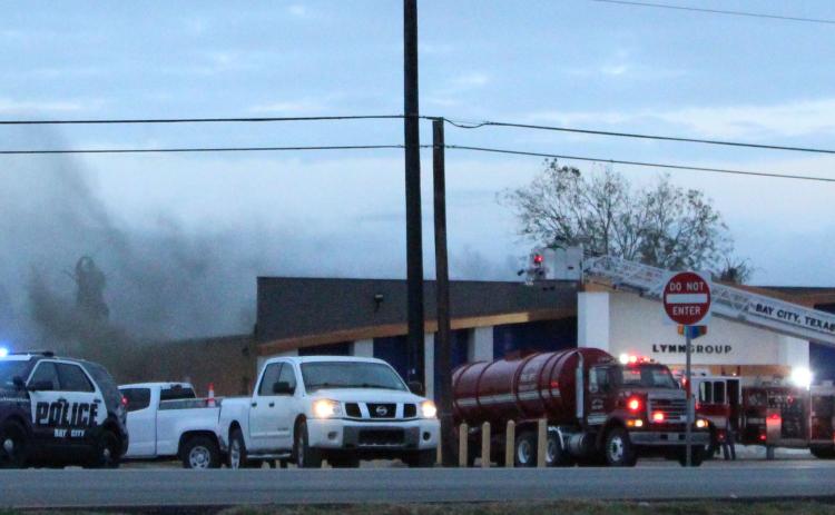 Photo/Anna Hernandez Area firefighters battle a fire that damaged the LynnGroup’s building on Texas 35 West, Wednesday evening, Nov. 24. The LynnGroup was ready to move into its new offices at the former Bowlera Fun Center after several months of renovation. The cause of the fire is still under investigation. Units responding included Bay City, Markham, Van Vleck and Midfield volunteer fire departments.