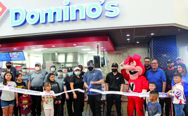 Sentinel photo/Jessica Shepard The Bay City Chamber of Commerce celebrated a ribbon-cutting ceremony with Domino's Pizza Saturday, Nov. 20. The pizzeria is located inside Walmart at 4600 Seventh Street in Bay City and delivers to Van Vleck residents.