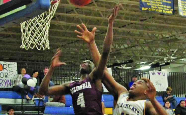 Sentinel photo/Mike Reddell Blackcat sophomore Carlon Jones (11) goes for a layup against a Columbia defender in Bay City’s 61-48 win over the Roughnecks here Feb. 1.