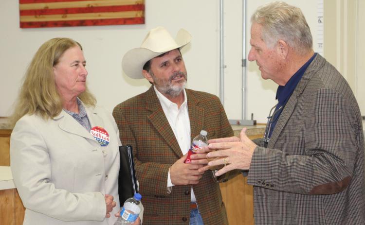 Sentinel photo/Mike Reddell Incumbent Precinct 4 JP Mark Finlay, right, visits with JP hopefuls Suzanne Sullivan (Precinct 2) and Jeff Elder (Precinct 6) following last week’s VFW politcal forum.
