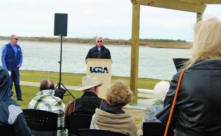 Sentinel photo/Mike Reddel Loy Sneary explains how the memorial was organized at the dedication Jan. 25.