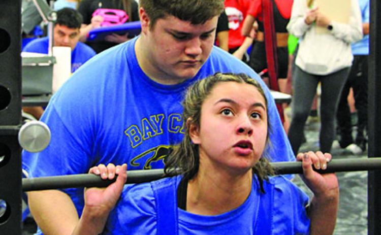 Sentinel photo/Mike Reddell Bay City High School Powerlifter Alexis Alvarez takes on the standing press at the Regional Powerlifting Tournament at BCHS last week..