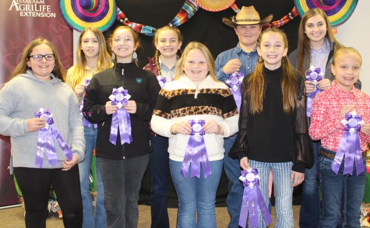 Sentinel photos/Jessica Shepard Matagorda County Fair and Livestock Association's Home Economics food entry winners received purple rosettes for their win as Grand Champions of their chosen divisions Saturday, Feb. 26. Winners include Marleigh Wendell, Camille Hutson, Taelynn Tinnin, Abigail Jurek, Jacob Oncken, Aribella Carson, Makayla Alford, Kali Claxton, Cheryl Saha, Jace Reynolds, Beatriz Valle, Shawn Sneath, Lacy Smith, Hunter Ryman, Emily Rodgers, and Ava Bowers.