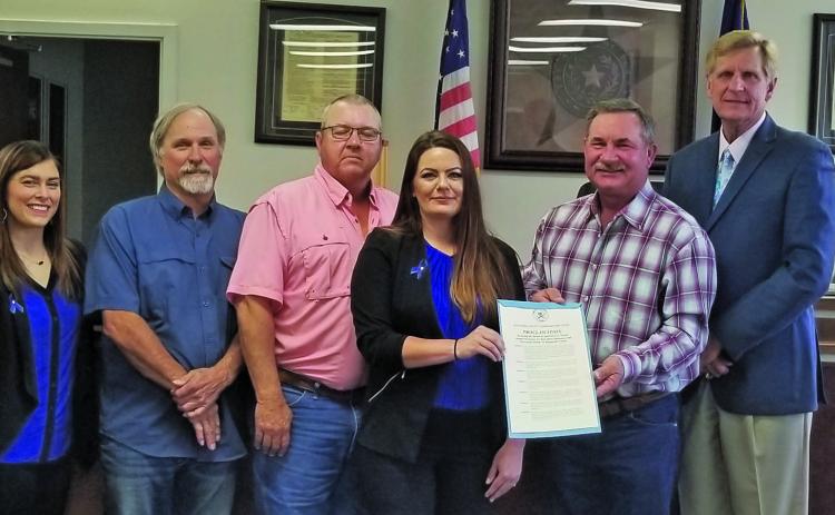 Sentinel photo/Mike Reddell Matagorda County Commissioners Court declared the month of April as Sexual Assault Awareness & Child Abuse Awareness and Prevention Month at the court’s meeting Monday. Shown, from left, are: Chris Hadash and Brittany Matthews, both with The Crisis Center, Precinct 1 Commissioner Bubba Cook, Precinct 4 Bubba Frick, Kelli Wright Nelson, with The Crisis Center, Precinct 3 Commissioner Troy Shimek, County Judge Nate McDonald, and Precinct 2 Commissioner Kent Pollard.