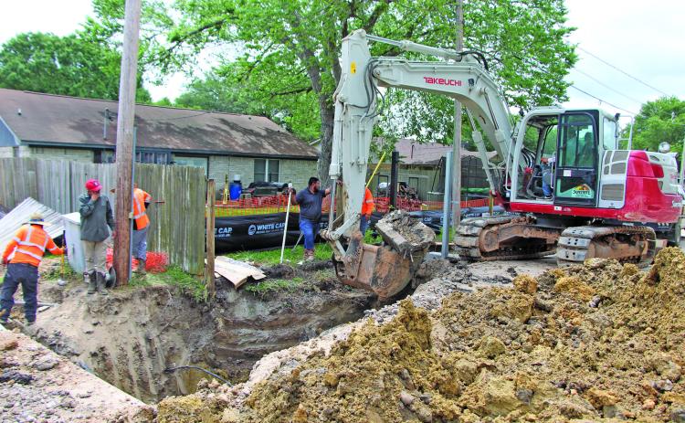Sentinel Photo/Mike Reddell An excavator digs out space for a drain on Hamman Road last week as part of the city’s  Phase 1B Hamman Road drainage project.