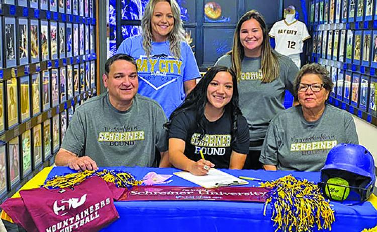 BCISD photo Ladycat softball standout Alyssa Gonzales signed with the Schreiner University Mountaineers in Kerrville on Wednesday, April 27. Alyssa is shown flanked by her parents, Tomas and Rachel Gonzales, and by her coaches behind her, Lindsey May (left) and Head Softball Coach Rilea Sanders. Alyssa lettered four years with the Ladycats and was offensive player of the year in 2020 and All-District Honorable Mention in 2021.