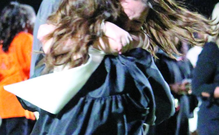 Sentinel photo/Jessica Shepard After their graduation ceremony, the Van Vleck High School class of 2022 shared their excitement with friends and family members in many ways - like this spirited hug Thursday, May 26.
