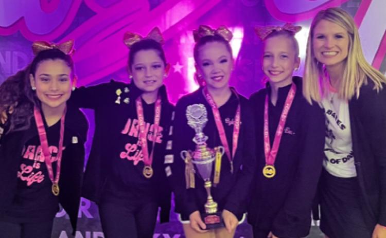 The Jazzettes are, from left, Kenzie Zamora, Mckinley Rocha, Ryleigh Siptak,  Eva Schneider, and Director Sarah Brashear