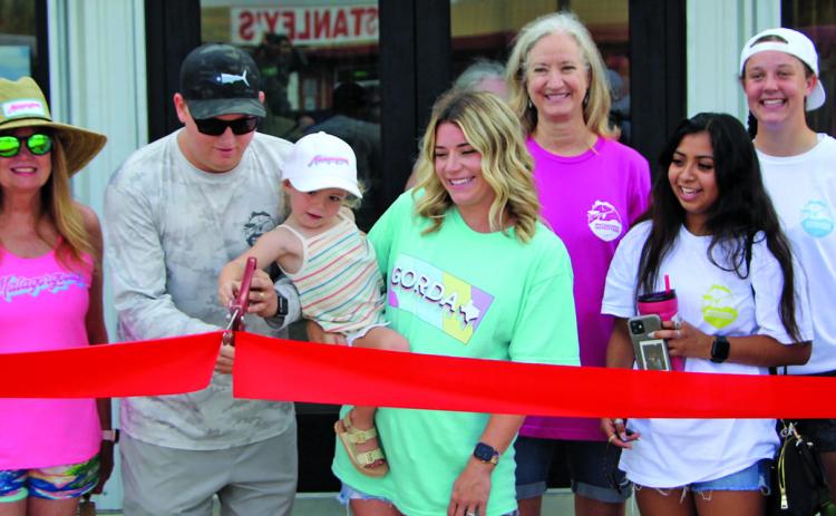Sentinel photo/Mike Reddell Matagorda Outfitters celebrated its expansion with a grand opening and a ribbon cutting Saturday, May 28. Matagorda Outfitters features coastal and fishing apparel and outdoor wear - plus they are saltwater fly tackle outfitters