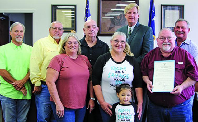 Sentinel photo/Mike Reddell Matagorda County Commissioners Court proclaimed June 2022 as Myuasthenia Gravis  Month at the court’s meeting Monday. Spokesman Simon DeSoto (second from right) said the disease is horrible, where the brain doesn’t communicate with the muscles and afflicts those from the young to the old.