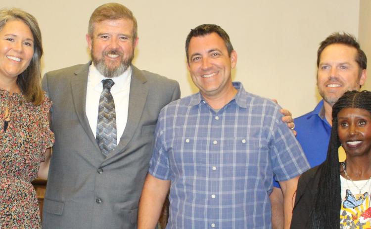 Sentinel photo/Jessica Shepard Newly hired Bay City ISD Superintendent Dr. Dwight McHazlett, Jr. (center left) joins trustees for a photo following their regular meeting Monday, Aug. 1.