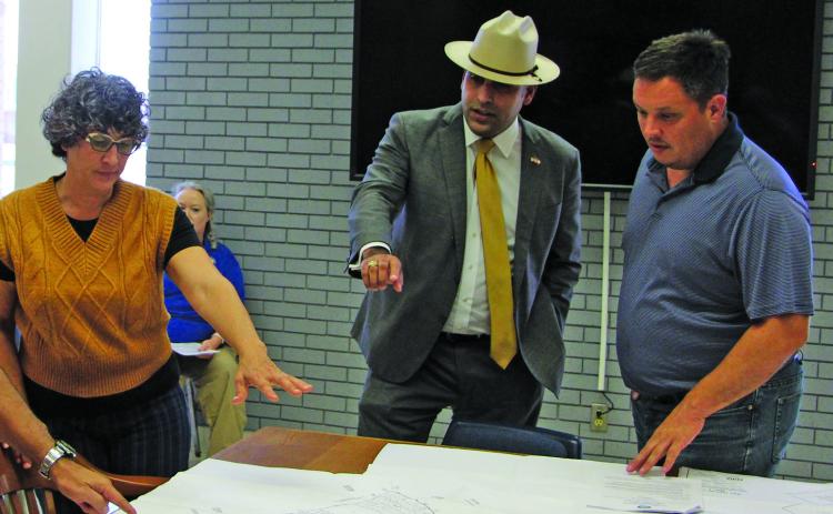 Sentinel Photo/Mike Reddell Bold Fox Development Managing Shareholder Alex Kamkar, center, explains subdivision plat to Planning Commissioners Zeinab Ghais, left, and Josh Fortenberry.
