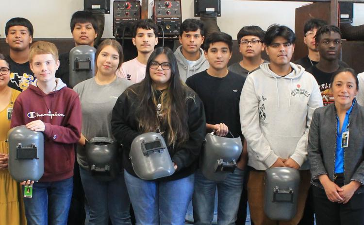 Contributed photo Bay City High School welding students, teachers and administrators join representatives and welders from Phillips 66-Sweeny Refinery, in marking the refinery’s donation of 20 welding hoods to the BCHS welding program.