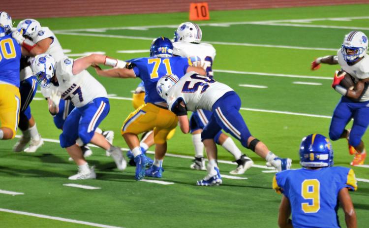 Photo/Dee Sneath Tiger running Joseph Dodds (5) gets an early opening for his run against Odem.