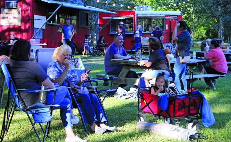 Sentinel photo/MaLinda Reddell People relax at the Full Moon Food Truck Festival Saturday evening, Oct. 15, at the Matagorda Birding Nature Center. The event had an impressive turnout and continues to grow, festival officials said.