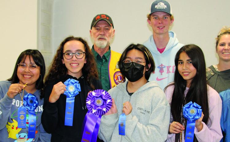 Sentinel Photo/Mike Reddell Winners of the annual Rice Dish Round-up contest were awarded blue ribbons on Tuesday, Oct. 18. Grand Champions, above, received purple ribbons along with a cash award and bag of rice. In no particular order are Lane Jacoby, grades 1-5; Jace Girndt, grades 6-8; Oscar Parga, grades 9-12; and Kathy Jackson, adult division. Not all are pictured.