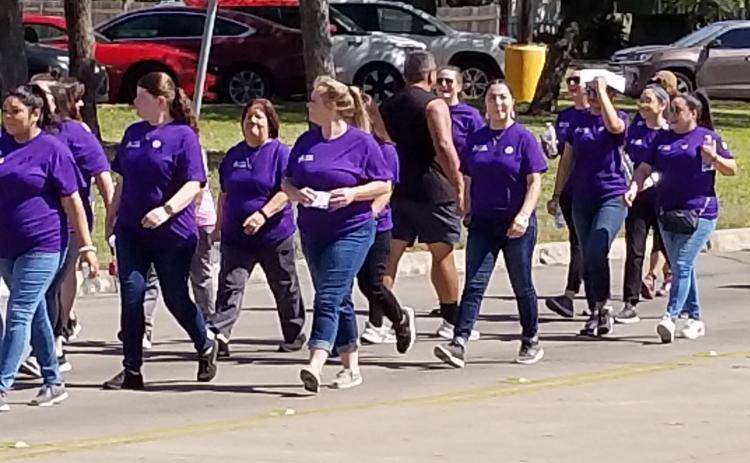 Sentinel Photo/Mike Reddell  Walk a Mile in Their Shoes was a mile-long walk from the Crisis Center to the courthouse Wednesday, Oct. 12. The Crisis Center-sponsored event was to bring awareness to domestic violence. At the courthouse there were guest speakers and a moment of silence.