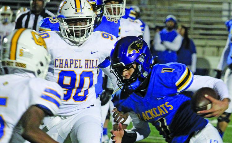 Sentinel Photo/Mike Reddell Blackcat quarterback Alex Estrada (1) picks up some tough yardage deep in Chapel Hill territory Friday night at Humble.