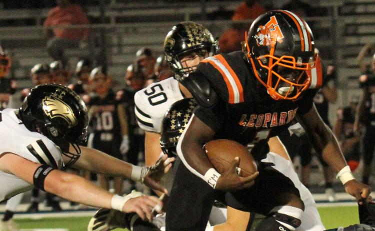 Photo/Anna Hernandez Van Vleck’s Cam Austin (1) does everything to get though Rogers defense line and stays on his feet to gain a few yards.