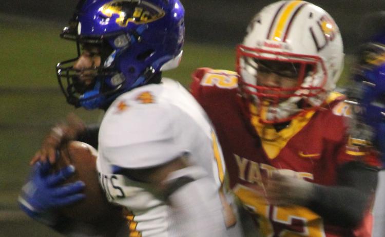 Sentinel photo/Mike Reddell Bay City running back Paris Fox (14) picks up yardage against Yates in the bi-district playoff in Houston, Friday, Nov. 11.