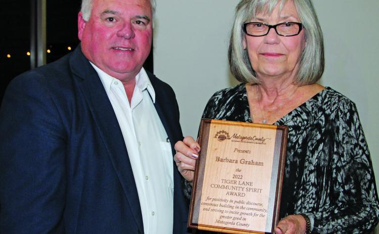 Photo by Mike Reddell Mitch Thames presents Tiger Lane Award to Barbara Graham