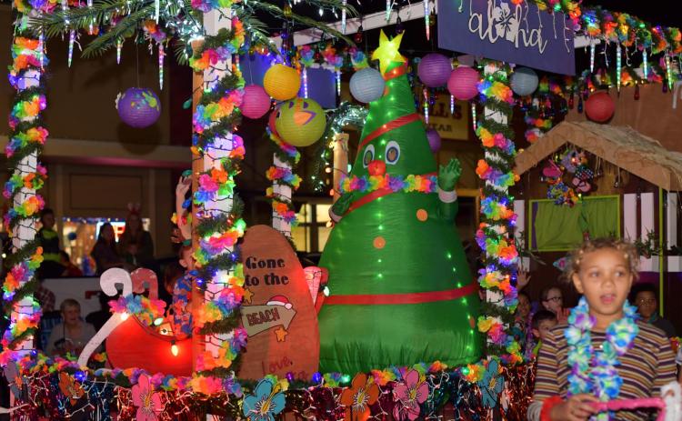Sentinel Photo/MaLinda Reddell Over 60 decorated and lit Christmas parade entries drew dozens downtown Friday, Dec. 2. The annual "Lighted Christmas Parade" was part of the two-day "HomeTown Christmas" event sponsored by the City of Bay City Parks and Recreation Department..